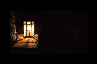 Illuminated lamp in dark room