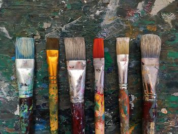 Close-up of paintbrushes on table