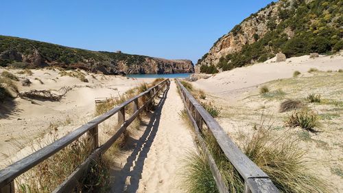 Panoramic shot of land against clear blue sky