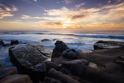 Scenic view of sea at sunset