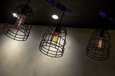 Low angle view of illuminated light bulbs