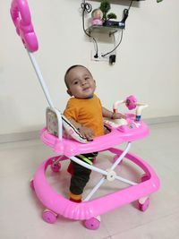 Cute baby girl sitting on floor