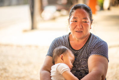 Portrait of mother and daughter outdoors