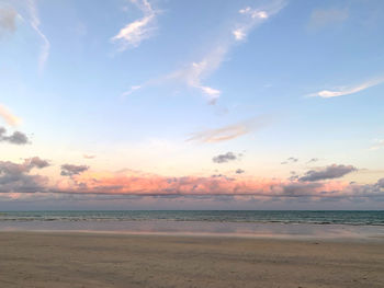 Scenic view of beach against sky during sunset