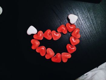 High angle view of heart shape over black background