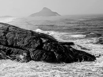 Scenic view of sea shore against sky