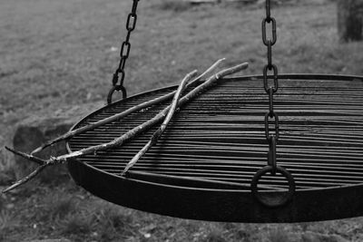 Close-up of swing hanging on rope