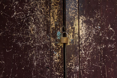 Close-up of padlock on door