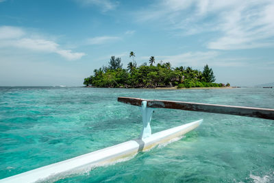 Scenic view of swimming pool by sea against sky