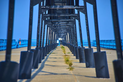Pier over sea against sky