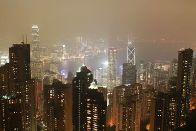 High angle view of illuminated cityscape at victoria harbour