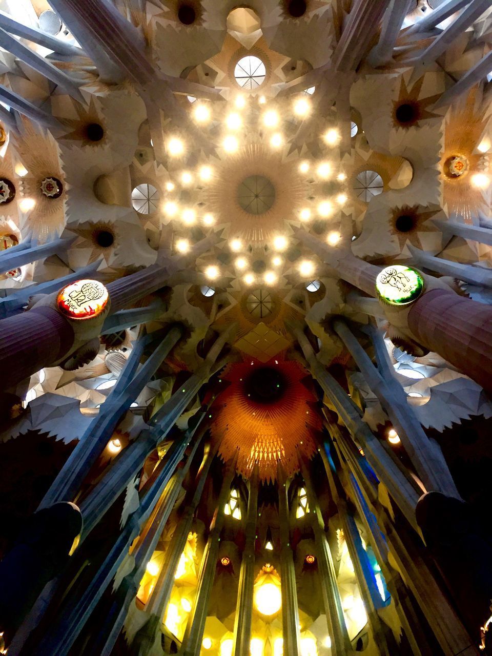 LOW ANGLE VIEW OF ILLUMINATED CHANDELIER