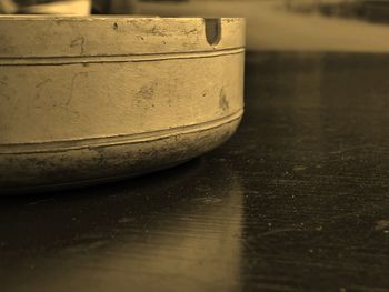 Close-up of ashtray on table