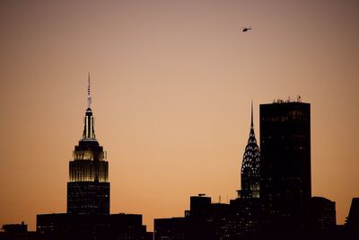 Empire state building and chrysler building at sunset