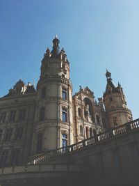 Low angle view of building against clear blue sky