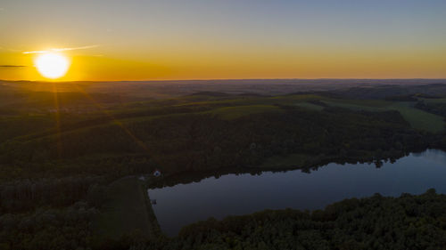 Scenic view of landscape against sky during sunset