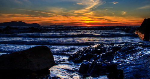 Scenic view of sea against sky during sunset