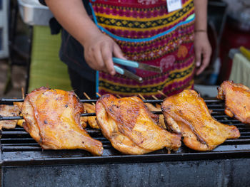 High angle view of meat cooking on barbecue grill