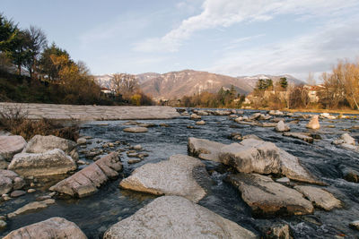 Scenic view of landscape and mountains against sky