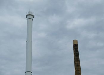 Low angle view of communications tower against sky