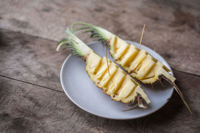 Close-up of pineapple slices in plate on table