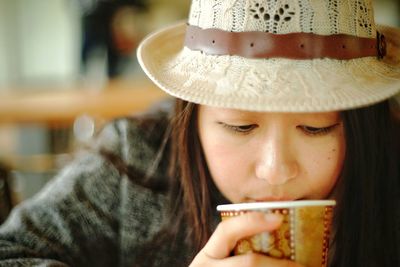 Portrait of woman drinking coffee