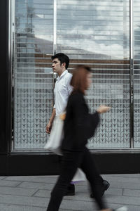 Low angle view of young man looking away