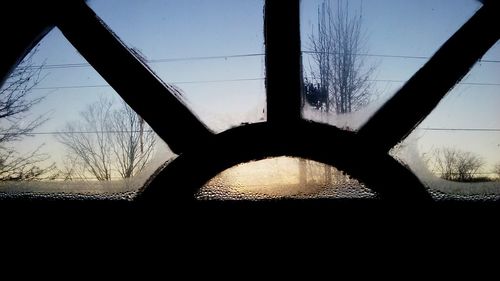 Bridge against clear sky seen through car windshield