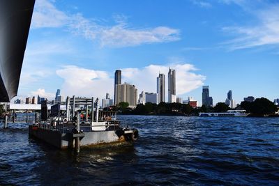 Panoramic view of sea and buildings against sky