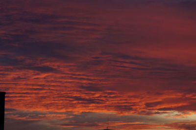 Low angle view of dramatic sky during sunset