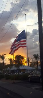 Flag against sky during sunset