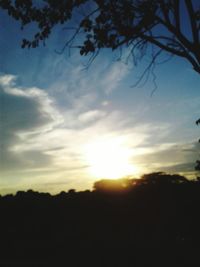 Scenic view of landscape against sky at sunset