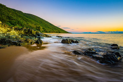 Scenic view of sea at sunset