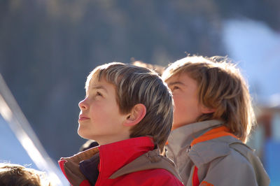 Friends looking away outdoors