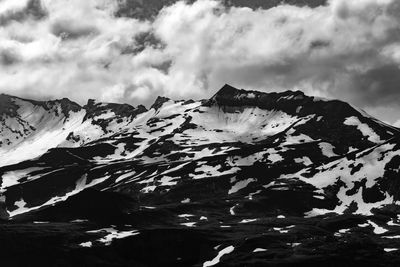 Scenic view of snow covered mountain against sky