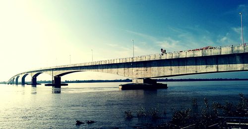 Bridge over sea against sky