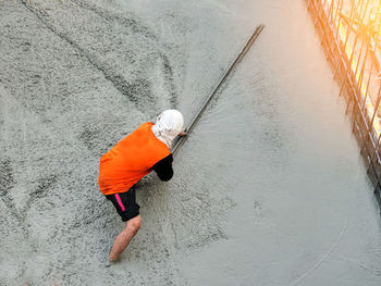 High angle view of man working on shore