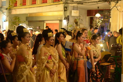 Group of people at market stall