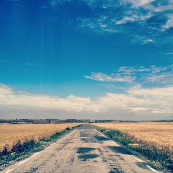 Road passing through field