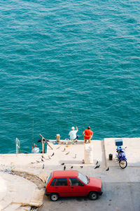 High angle view of men fishing in sea