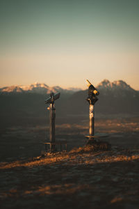 Close-up of monocular against mountain range