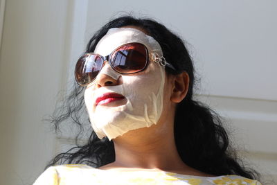 Close-up of woman with facial mask