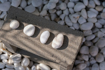 High angle view of pebbles on rocks