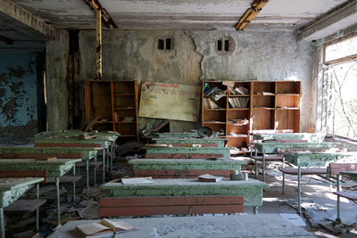 Empty chairs in abandoned building