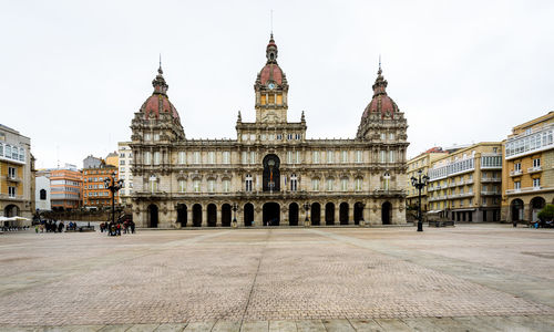 Facade of historic building against sky