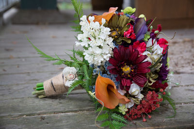 Close-up of bouquet on wooden table