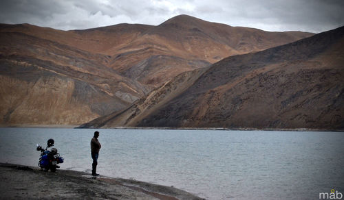 Scenic view of lake with mountains in background