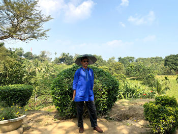 Portrait of mature man standing in park