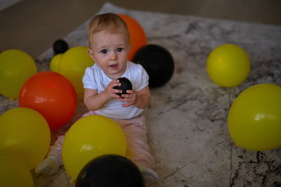 Portrait of cute girl with balloons