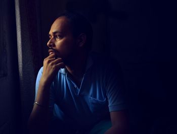 Portrait of young man looking away